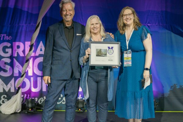 Plein Air Publisher Eric Rhoads and Plein Air Salon MAnager Kari Stober presenting the PleinAir Salon Annual Award of Best Watercolor to Deborah Chabrian