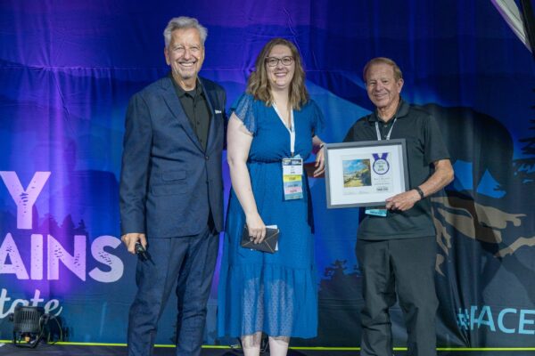 Plein Air Publisher Eric Rhoads and Plein Air Salon MAnager Kari Stober presenting the PleinAir Salon Annual Award of Best Acrylic to Rick J. Delanty