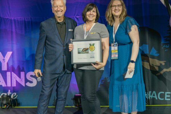 Plein Air Publisher Eric Rhoads and Plein Air Salon MAnager Kari Stober presenting the PleinAir Salon Annual Award of Honorable Mention to Lisa Mozzini-McDill