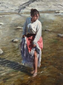 A woman in a white blouse and pink skirt holds up her dress as she wades barefoot through shallow water, with sunlight reflecting off the surface and rocks scattered around. 15th Annual PleinAir Salon Art Competition