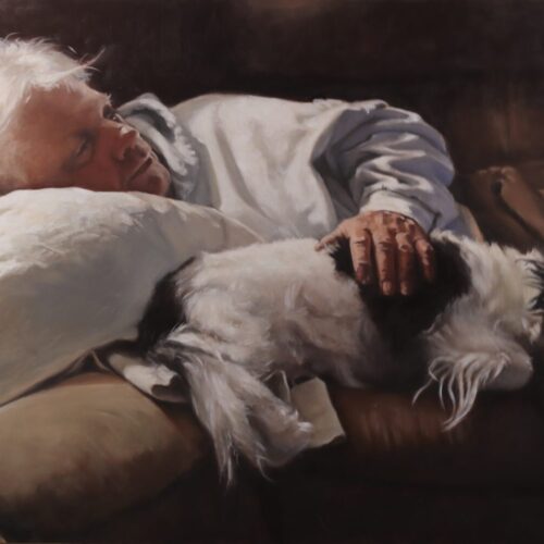 An older person with white hair naps on a couch, resting their head on a pillow, with one hand gently placed on a small black-and-white dog lying beside them. Both appear peaceful and relaxed. 15th Annual PleinAir Salon Art Competition