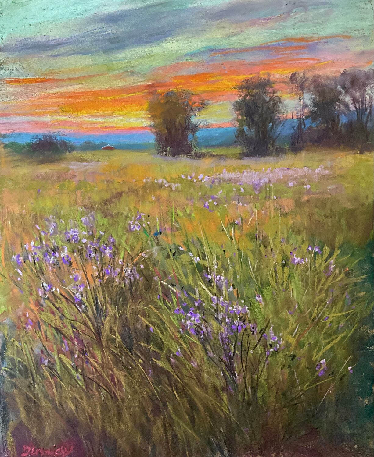 Colorful sunset over a grassy field with purple wildflowers in the foreground and trees in the background, painted in soft, vibrant hues. 15th Annual PleinAir Salon Art Competition