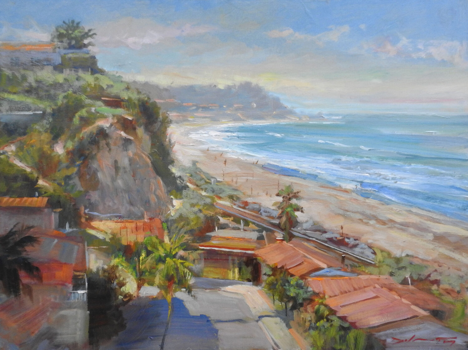 A vibrant coastal painting depicts red-roofed buildings, palm trees, cliffs, and a sandy beach with waves under a bright blue sky. The shoreline curves into the distance, evoking a warm, sunny atmosphere. 15th Annual PleinAir Salon Art Competition