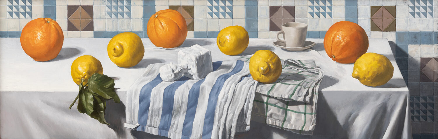 A still life painting of oranges and lemons on a white table with two cloths, a cup, and sugar cubes, set against a tiled blue-and-brown patterned wall. 15th Annual PleinAir Salon Art Competition