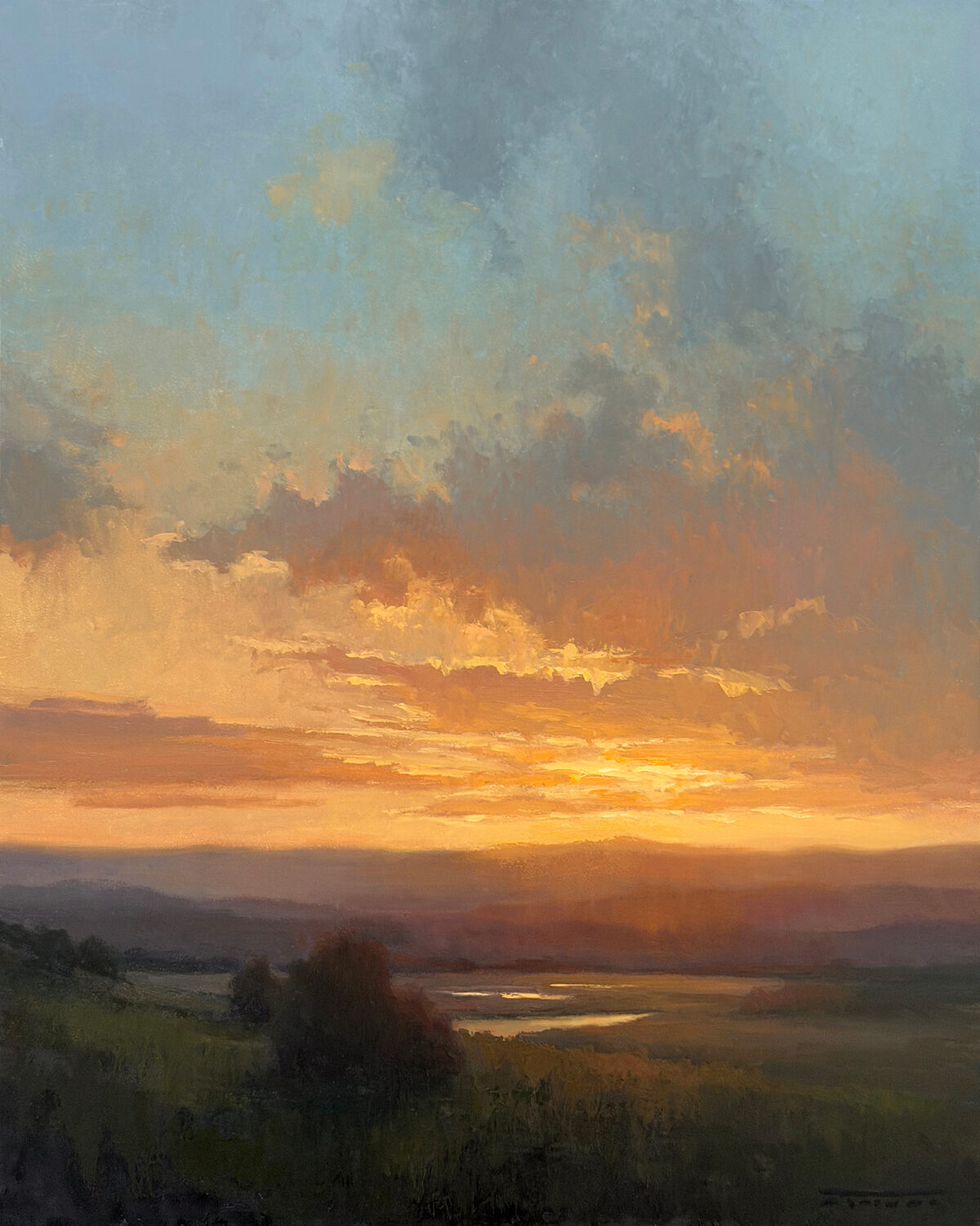 Golden sunset over a grassy landscape with a river reflecting the sky; orange, yellow, and blue tones color the clouds, creating a peaceful and serene atmosphere. 15th Annual PleinAir Salon Art Competition